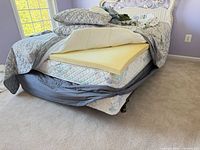 Metal bed frame with mattress, box spring, foam topper displayed