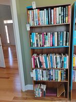 Full front view of tall bookcase with five shelves