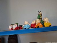 Group shot of all figures on shelf