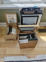 Three boxes and several loose frames of varying sizes