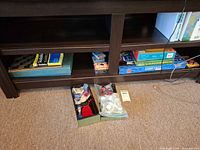 Shelf with board games, poker chips set open in front