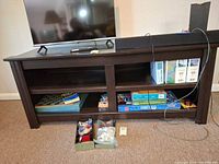 Front view of dark espresso media stand with open shelves