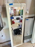 Front view of one mirror leaning against wall