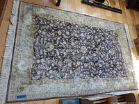 Full view of the 4' x 6' floral area rug showing pattern, colors and fringe