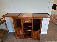 Full view of bar server with top panels open showing compartments