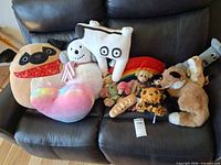 group shot of all stuffed toys on couch