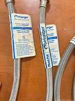 Belanger branded stainless braided supply lines with tags