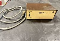 Front view showing Allanson logo, on-off switch, red indicator lamp and attached power cord