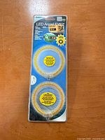 Front of sealed Alpena LED Angel Eyez blister pack showing two amber rings