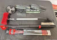 All items laid out: three mirrors, 12V fan, telescoping brush, Bosch wiper blade