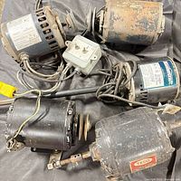 Group of five motors, pulleys, cords, and control box