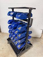 Full view of rolling rack with blue bins attached