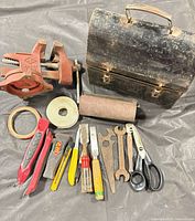 Group shot showing all tools including vise, toolbox, cutters, wrenches, pliers, scissors, tape and sandpaper