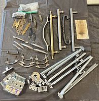 Overview of assorted pulls, drawer slides, brackets and screws