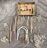 Full lot overview showing all metal hardware, chisels, hammer heads, U-bolts and chains