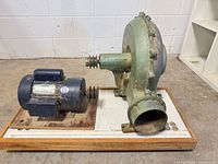 Blower housing and Leeson motor side view on plywood base