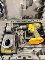 Drill/driver with battery and charger inside case