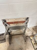 Top view showing twin wooden jaws, screw handles and metal frame
