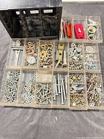 Cabinet with drawers removed, showing hardware contents
