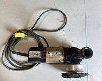 Full view of Porter-Cable random orbital sander with cord, side handle, and pad