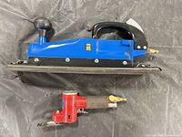Side view of both pneumatic sanders
