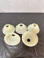 Five frosted opal glass lamp shades top and side view