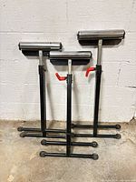 Front view of three roller stands folded