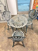 Full view of table with three matching chairs
