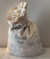 Front view of filled U.S. Mint canvas bag stamped CENTS $50