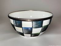 Side view showing full checkered pattern and gold rim