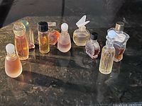 Front view of all ten miniature perfume bottles