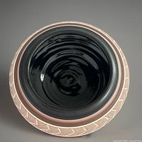 Top view showing black glazed interior and shape