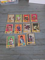 Fronts of eleven vintage hockey cards showing players and NHL Action subset