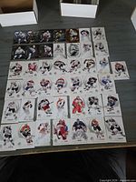 Overview of approximately 45 hockey cards laid out in grid