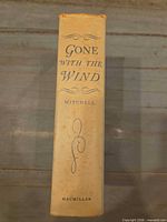 Spine of beige cloth hardcover showing title, author and publisher