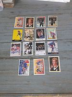Fronts of all 15 hockey cards laid out on table