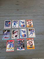 Fronts of all ten Joe Sakic trading cards laid out on table