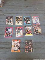 Front view of eleven Mario Lemieux trading cards laid out on table