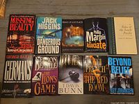 Group shot of all hardcover books laid out on table