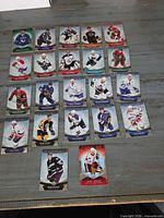 Top-down view of 25 Upper Deck Trilogy hockey trading cards spread out on a tabletop