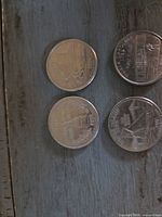 All four quarters obverse side up showing reverse designs