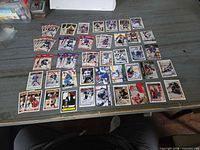 Front view of roughly 70 assorted hockey cards laid out face-up