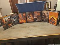 Front view of all six DVD cases standing in a row