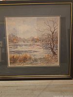 Full view of framed watercolor landscape painting