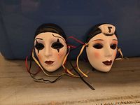 Both masks side by side showing overall design and ribbon ties