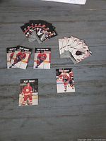 All nine loose Play Smart hockey trading cards laid out on table showing fronts and player images
