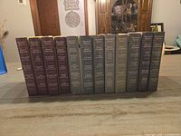 All 14 Reader’s Digest Select Editions volumes standing side-by-side on tabletop