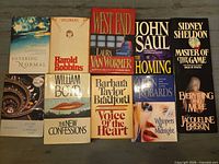 Group shot of 10 hardcover fiction books with dust jackets