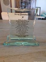 Front view of clear glass grandmother plaque on aqua base