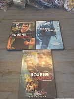 Front covers of the three Bourne DVDs